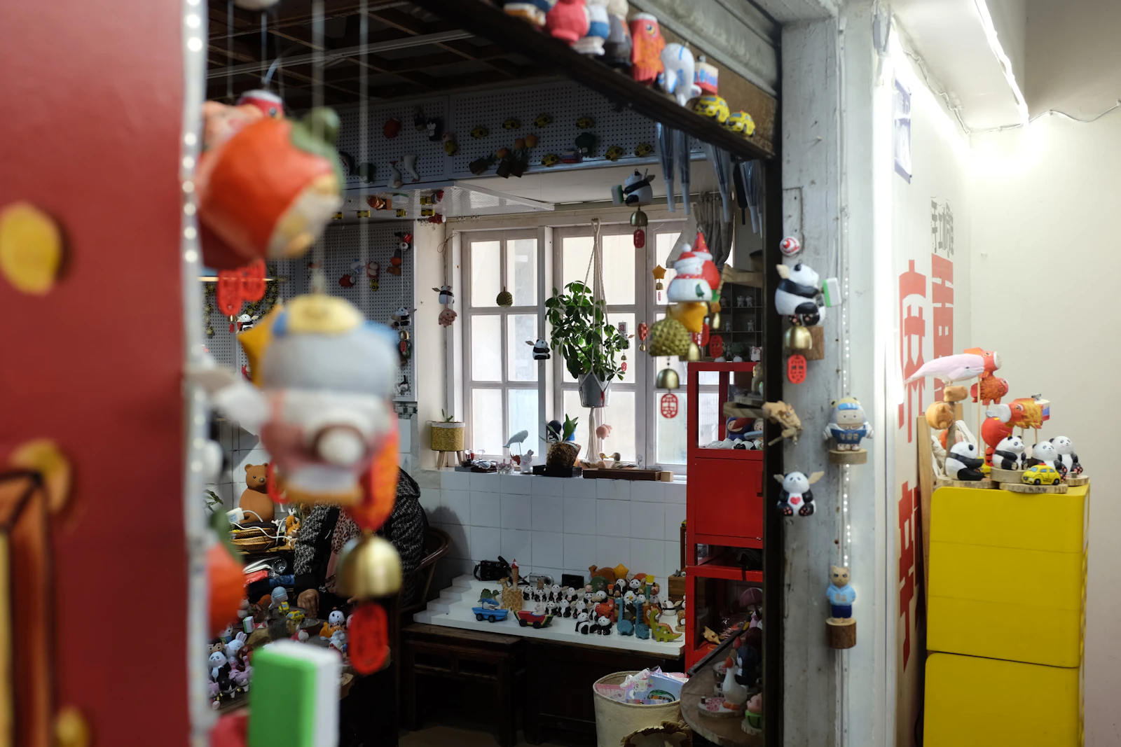 Souvenir shop window with traditional Portuguese ceramics and sardine tins