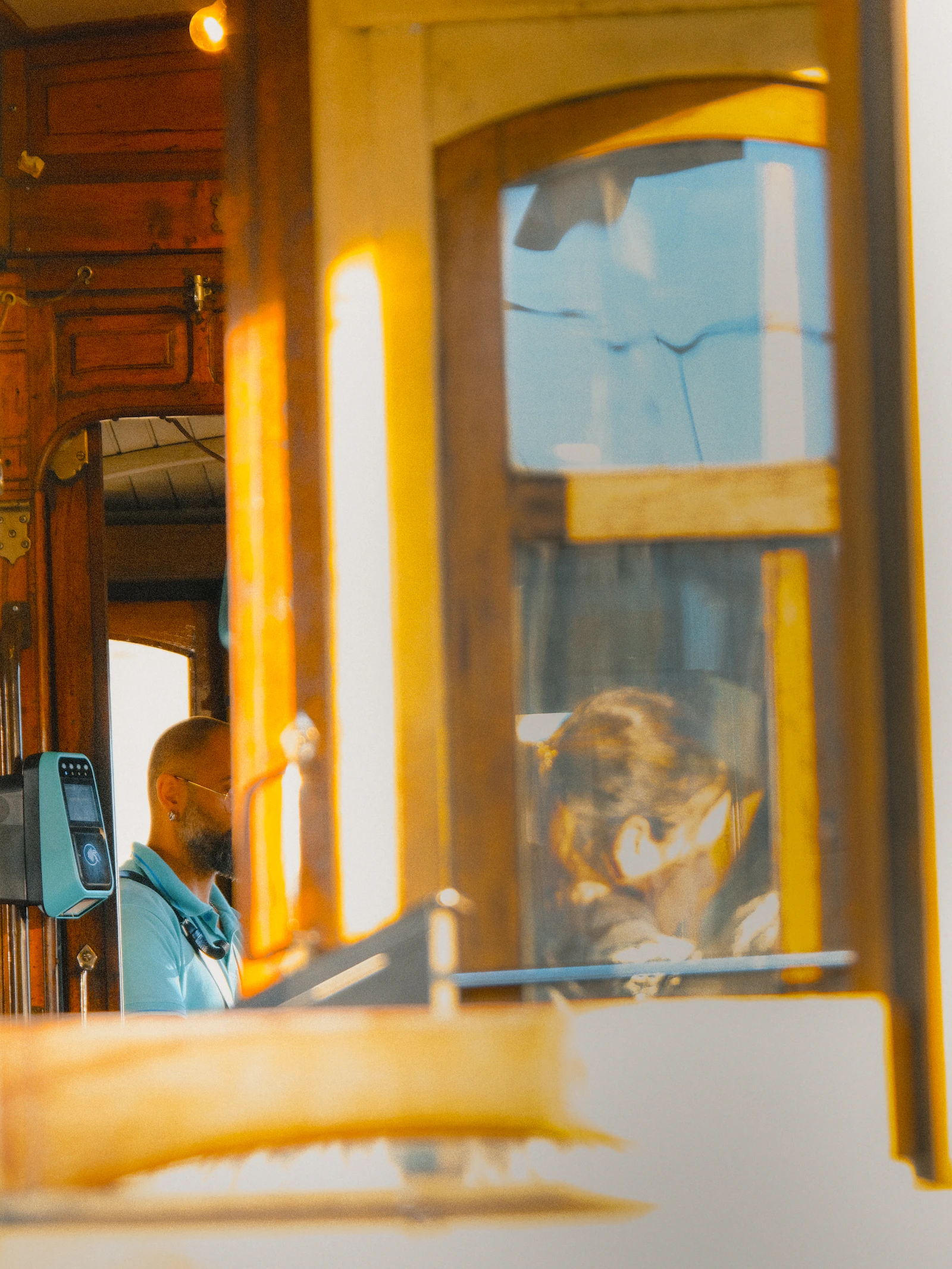 View from inside a Lisbon tram showing the city through the window