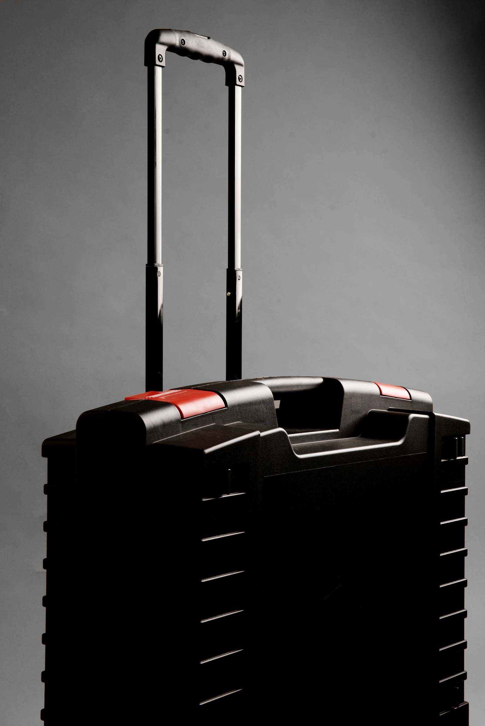 Luggage handle on a sunlit marble floor of a Lisbon airport terminal